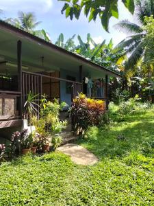 a house with plants in front of it at Izzahjay homestay in Burgos