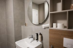 a bathroom with a sink and a mirror at Apartment Nuve in Bjelašnica +39 photos