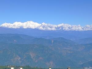 a mountain range with snow capped mountains in the background at Homestay Blue Horizon in Darjeeling