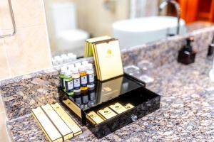 a bathroom counter with a bottle of essential oils at Premium Hotel Ulaanbaatar in Ulaanbaatar +38 photos