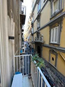 a view of an alley from a balcony of a building at Donnalbina 7 The Fresh BB in Naples