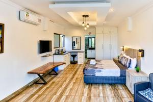 a living room with a bed and a couch at Van Gogh in Ballito