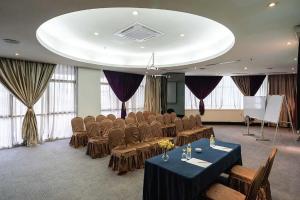 a conference room with chairs and a table and a podium at Vivatel Kuala Lumpur in Kuala Lumpur +98 photos