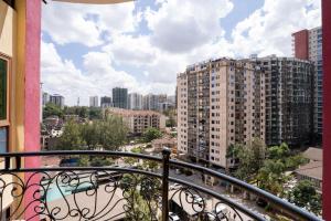 a balcony with a view of a city at Luxurious Nairobi Apartment with Shared Pool and Modern Amenities in Nairobi
