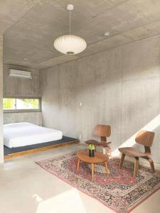 Ένα ή περισσότερα κρεβάτια σε δωμάτιο στο Stay Hotel Nakijin