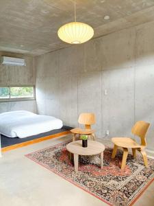 Χώρος καθιστικού στο Stay Hotel Nakijin