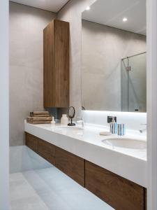 a bathroom with a sink and a mirror at A27 Apartments in Almaty