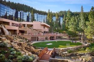 a resort with a golf course in front of a building at Remodeled Second Floor Valley View suite no resort fee in Olympic Valley