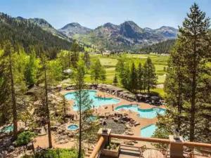 a view of a river with trees and mountains at Remodeled Second Floor Valley View suite no resort fee in Olympic Valley +21 photos