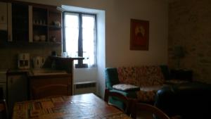 Posezení v ubytování Maison de vacances Le Pigeonnier