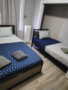 Ένα ή περισσότερα κρεβάτια σε δωμάτιο στο Full Downtown Access-Central Location-Self Checkin