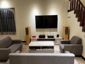 TV a/nebo společenská místnost v ubytování 哈娜家Villa