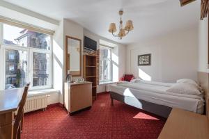 Postel nebo postele na pokoji v ubytování Alexa Old Town