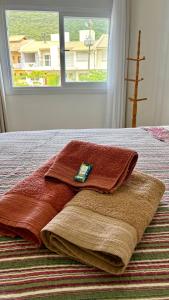 Ένα ή περισσότερα κρεβάτια σε δωμάτιο στο Ape Panoramico no Centro com ar condicionado