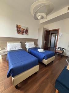 Postel nebo postele na pokoji v ubytování Enjoy Milano Skyline