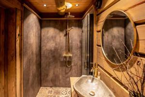 a bathroom with a sink and a mirror at Cabin With Great Fishing At Trysilfjellet in Jordet +31 photos