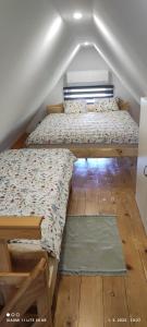 a bedroom with two beds and a window at Holiday home Vukovoj in Klenovnik