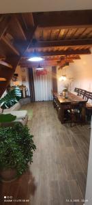 a room with a wooden table and a dining room at Holiday home Vukovoj in Klenovnik