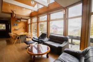 a living room with a couch and a table at The lakeview toya Shirokumanoyado in Lake Toya