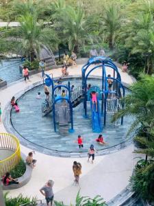 a group of people playing in a water park at The Song Apartment 5 Stars Vung Tau - Căn Hộ Du Lịch 5 Sao Cạnh Biển - DUMIN HOMESTAY in Vung Tau