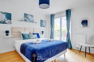 Ένα ή περισσότερα κρεβάτια σε δωμάτιο στο Elegant appartement proche de l'hippodrome