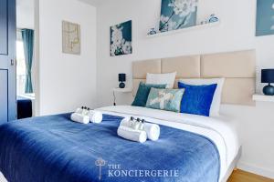 Ένα ή περισσότερα κρεβάτια σε δωμάτιο στο Elegant appartement proche de l'hippodrome +8 φωτογραφίες