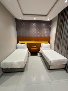 Postel nebo postele na pokoji v ubytování شقق ثري ستار للشقق الفندقية 6