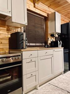 Η κουζίνα ή μικρή κουζίνα στο Dom całoroczny 6-8 osobowy
