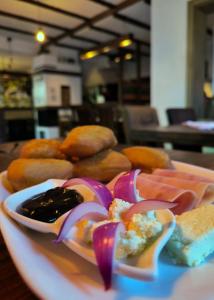 a plate of food on a table with food at Apartment Lana Vareš in Vareš