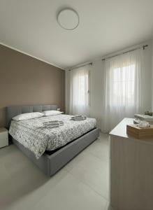 Ένα ή περισσότερα κρεβάτια σε δωμάτιο στο soffio del mar +6 φωτογραφίες