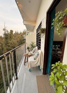 a balcony with a table and a view at Aman Nest in Jāmb