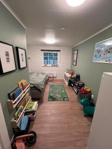 a room with a bedroom with a bed and toys at Beautiful and private with heated pool & hot tub in Ljungbyhed +13 photos