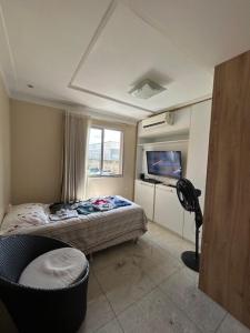 En eller flere senge i et værelse på COP 30 aconchego e conforto