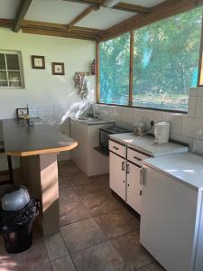 a kitchen with a sink and a counter top at Proudly Okavango self-catering Burnside in Shakawe +32 photos