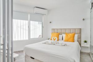 a bedroom with a bed with two towels on it at Las Tortugas Bungalow Beach in Arona +18 photos