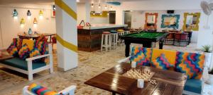 a living room with a pool table and a bar at goSTOPS PLUS Goa, Vagator in Goa Velha