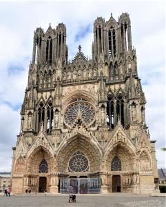 a large cathedral with a lot of windows at Wellness Suite Ponsardin 1 - Reims Centre in Reims