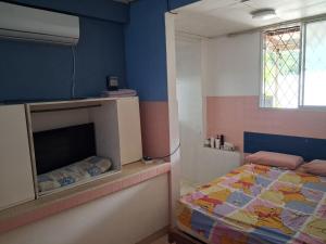 Ένα ή περισσότερα κρεβάτια σε δωμάτιο στο Taman Fortune