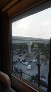 a view from a window of a parking lot at Hotel LOTO Premier Vijay Nagar in Jāmb