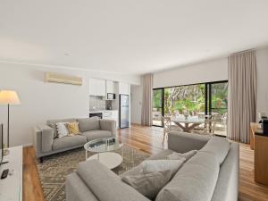 a living room with a couch and a table at Wren Studio - Private One-Bedroom Studio Nestled in Bushland in Yallingup
