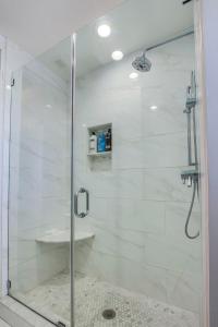 a shower stall with a glass door in a bathroom at 6br New Orleans Speakeasy Hot Tub & Playground in Louisville +53 photos