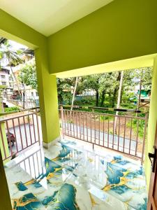 a balcony with a mural on the floor at Radhika Residency in Perintalmanna