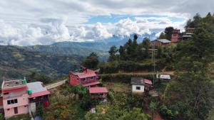 a group of houses on the side of a mountain at Namaste Home Stay in Dhulikhel