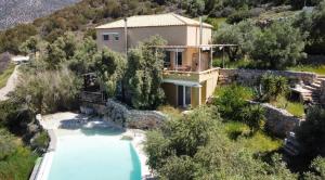 an aerial view of a house with a swimming pool at Melolia Estate in Thiva