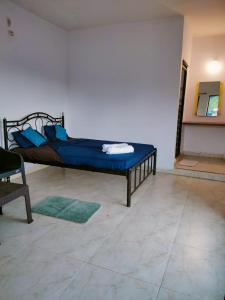 Ένα ή περισσότερα κρεβάτια σε δωμάτιο στο Prima Guest House Arambol