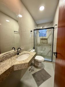 Koupelna v ubytování Suítes da Grazi - Centro Arraial do Cabo + 45 fotografií