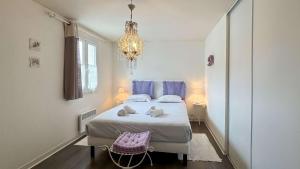 Postel nebo postele na pokoji v ubytování Charmante location à quelques pas du port et des restaurants