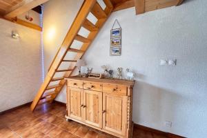 a bathroom with a sink and a staircase at Alpine stay at the foot of the slopes in Crest-Voland
