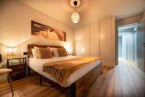 a bedroom with a large bed in a room at Extra Large 2BR Apartment Next to Metro Station in Bicas