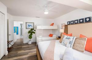 a bedroom with a bed and a bunk bed at Saltwater Lagoon Front View, Marina, Kayaks in Key Largo +74 photos
